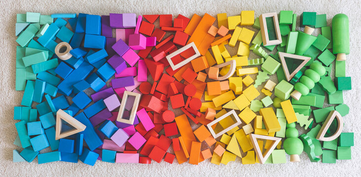 Rainbow spectrum Montessori material wooden bricks row imagination seamless pattern background