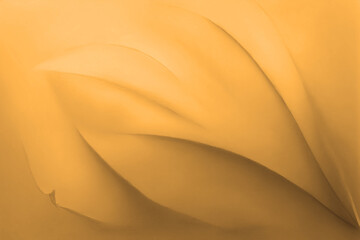 Gold yellow background texture, wavy silky black, golden and brownish shades of colors beautiful, hot and flowing design
