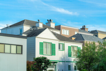 Row of modern house facades with decorative roofs in family neighborhood in San Francisco California