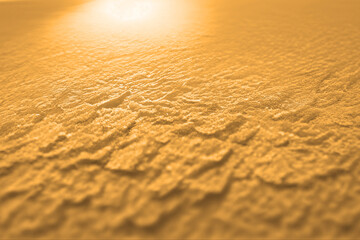 Gold yellow background texture, wavy silky black, golden and brownish shades of colors beautiful, hot and flowing design
