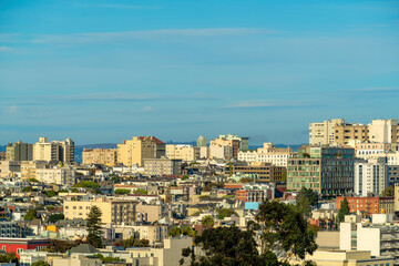 Fototapeta premium A great many buildings in downtown San Francisco California in a neighborhood with houses and businesses in late afternoon sun