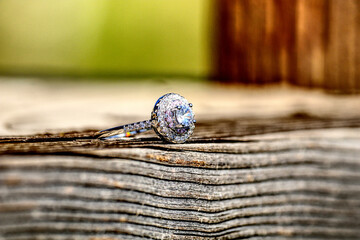 Engagement Ring on Wood Table Close-Up 