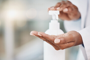 Healthcare, cleaning and covid rules at hospital by doctor disinfect hands with hand sanitizer. Compliance, safety and corona control by health expert closeup of good hygiene in fresh clean workspace