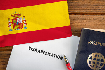 Visa application form, passport and flag of Spain
