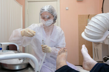 Treatment of toenail fungus in the hospital.