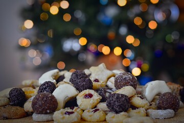 Cozy winter and Christmas setting with homemade cookies and sparkling lights