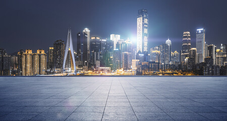 Fototapeta na wymiar modern building and empty floor with skyline. Panoramic urban architecture, cityscape with space