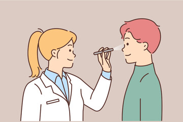 Female doctor examine male patient sight 