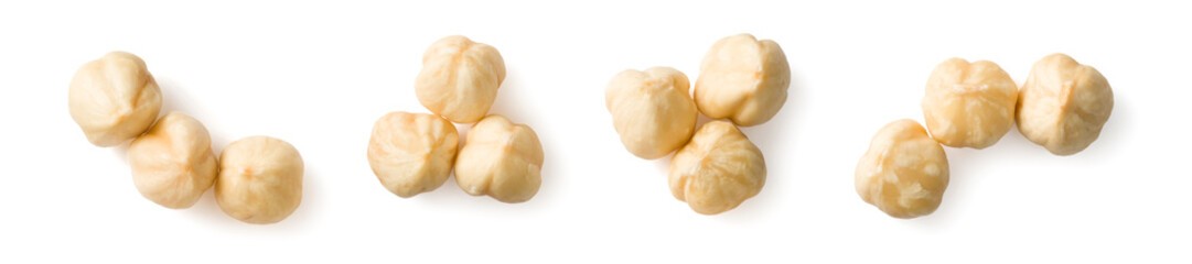 Peeled hazelnuts isolated on the white background, top view