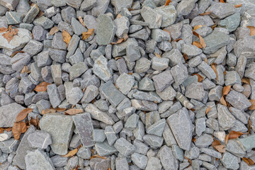 The texture of coarse gravel lying on the floor