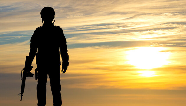 Silhouette of a soldier against the sunset