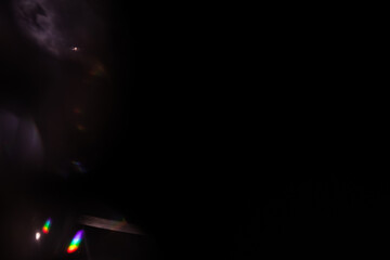 Blur colorful rainbow crystal light leaks on black background. Defocused abstract multicolored retro film lens flare bokeh analog photo overlay or screen filter effect. Glow Vintage prism colors