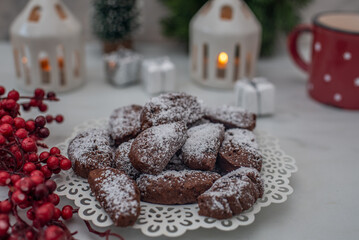 sweet home made chocolate christmas cookies on a christmas table