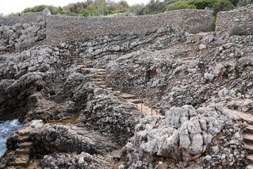 stones rocks path way pedestrian access to sea beach in south Antibes France southeast