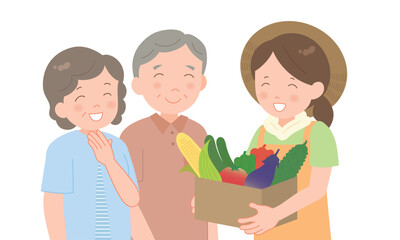 夏野菜の段ボールを持つ女性とシニア夫婦