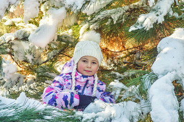 Happy little girl on a winter walk - 550212548