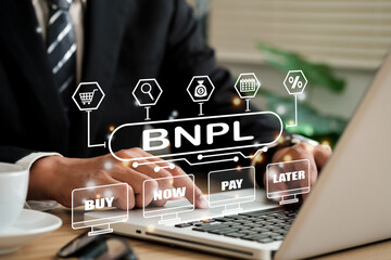 BNPL Buy now pay later online shopping concept. Businessmen using a computer to BNPL with online shopping icons technology.. - obrazy, fototapety, plakaty