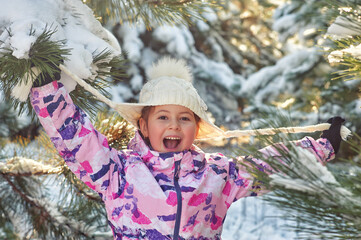Happy little girl on a winter walk - 550212555