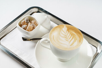 cup of cappuccino with sugar