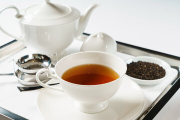 tea in the teapot on tray