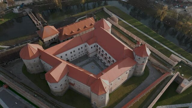 Static aerial drone flight over the castle Cetatea Făgărașulu in Făgăraș in Rom&acirc;nia - Fagaras in Romania is a touristic city in the historical region of Transylvania near the Olt River - bird view