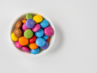 ramakin of candy on a white background