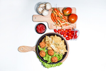 chicken baso appetizer with dumplings and tomato sauce