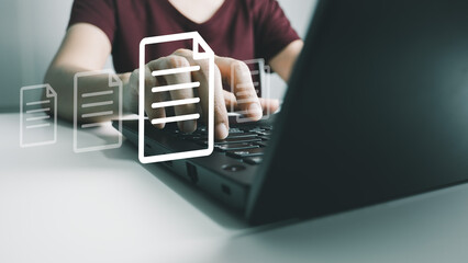 Obraz premium Officer using laptop manage files, Document Management System (DMS), Online document database management, automated processes to manage system, ERP enterprise efficient, business technology.