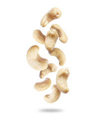 Dried cashew nuts close-up in the air isolated on a white background