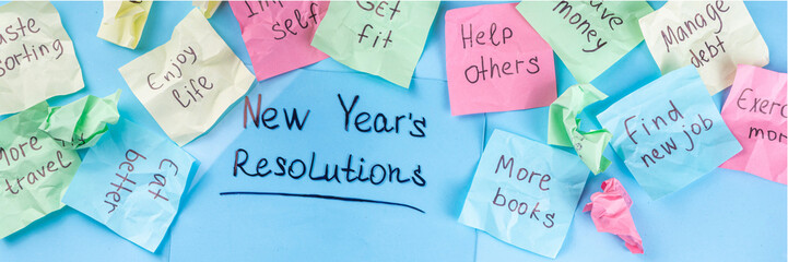 New year goals or resolutions on bright colorful paper stickers. New Year goals List 2023, plan listing of new year beginnings goals and resolutions setting. Flat lay copy space on blue background - obrazy, fototapety, plakaty