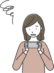 スマートフォンの画面を見てがっかりする女性