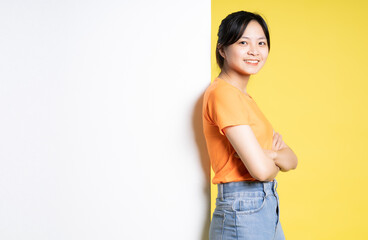 image asian girl posing with billboard