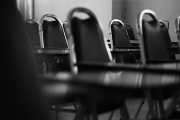 Lecture chairs in the room on black and white