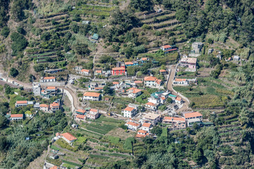 Fototapeta na wymiar aerial with houses among terraced fields at Curral das Freiras mountain village, Madeira