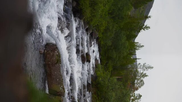 Vertical Screen: The swift and indomitable flow of a mountain river.