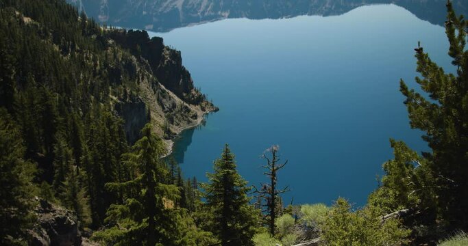 Trees and cliffs leading down to a lake