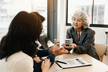 Considering buying a home, investing in real estate. Broker signs a sales agreement. agent, lease agreement, successful deal .