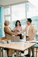 Fototapeta premium business people shaking hands during a meeting in office