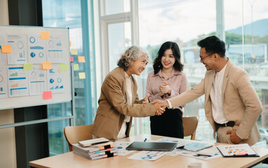 business people shaking hands during a meeting in office