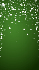 Snowy christmas background. Subtle flying snow flakes and stars on christmas green background. Delicate sweet snowy christmas. Vertical vector illustration.
