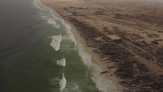 Aerial shot moving backwards of the Port peche beach, Nouakchott, Mauritania.