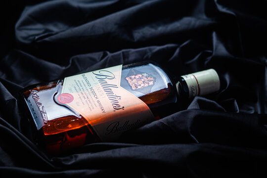 Bottle of Ballantine's Whiskey on dark background