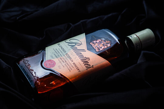 Bottle of Ballantine's Whiskey on dark background