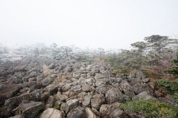 Frosty and foggy mountain climbing