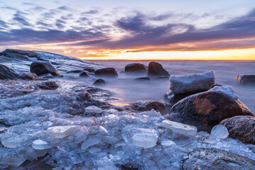 Sunset over an icy beach. Pörkenäs, Finland