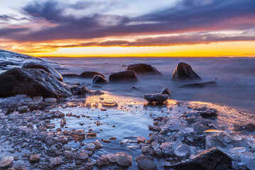 Sunset over an icy beach. Pörkenäs, Finland