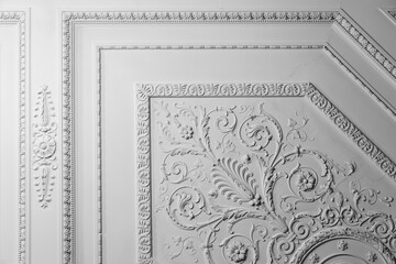 Obraz premium White ceiling design elements in rococo style, bas-relief