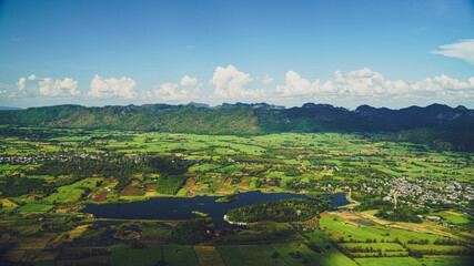 Obraz premium Picture from the highest point of Wat Khao Sam Yot. Phu Pha Man District Khon Kaen province with the sky, rice fields, mountains surrounding the countryside in Thailand.