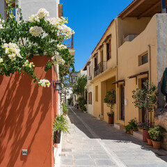 The white bougainvillea, the colorful houses, the lanterns and the many planters characterize the cozy alleys in the old town of Rethymno, Crete, Greece
