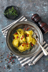 Homemade ravioli with potato and ricotts cheese served with crispy bacon. Top view with copy space. 